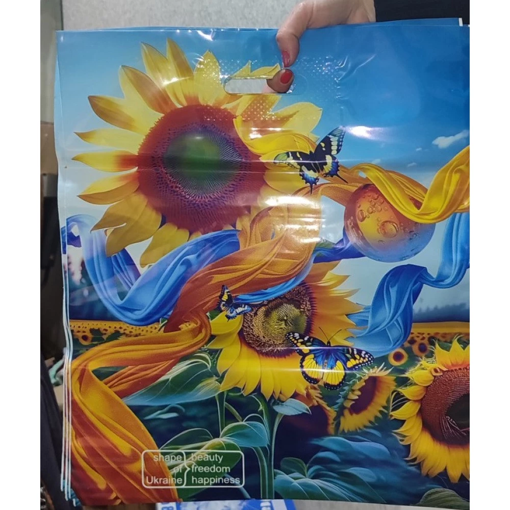 Прорізна ручка 40*45, 75мкм, Квіти (тип газета) “Comserv“,  уп.-25шт.